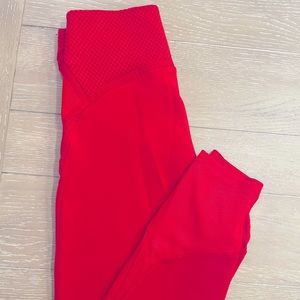 Red Nike 7/8 lengths leggings in size medium.